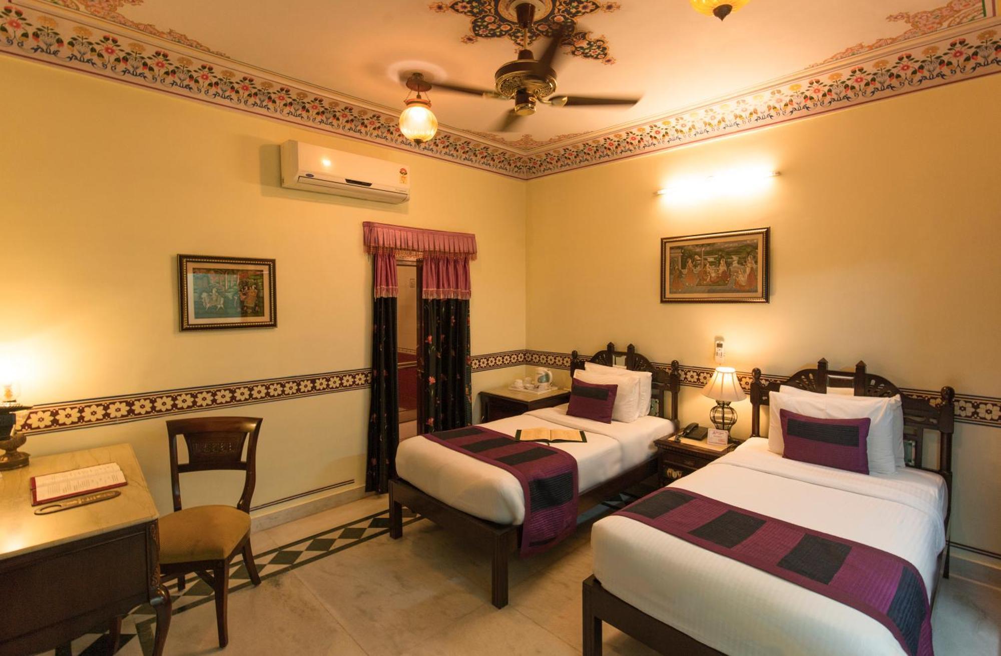 Royal Deluxe Room pickup on arrival from train or bus station Enjoy a daily Rajasthani dance & music show from 7–9 PM swimming pool a dedicated travel desk to assist local sightseeing tours intercity travel arrangements & activitie