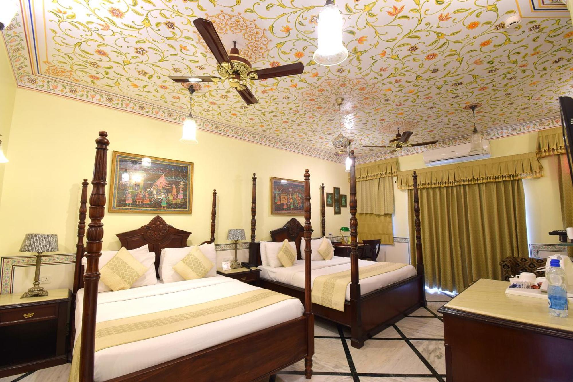 Royal Suite Family pickup on arrival from train or bus station Enjoy a daily Rajasthani dance & music show from 7–9 PM swimming pool a dedicated travel desk to assist local sightseeing tours intercity travel arrangements & activiti