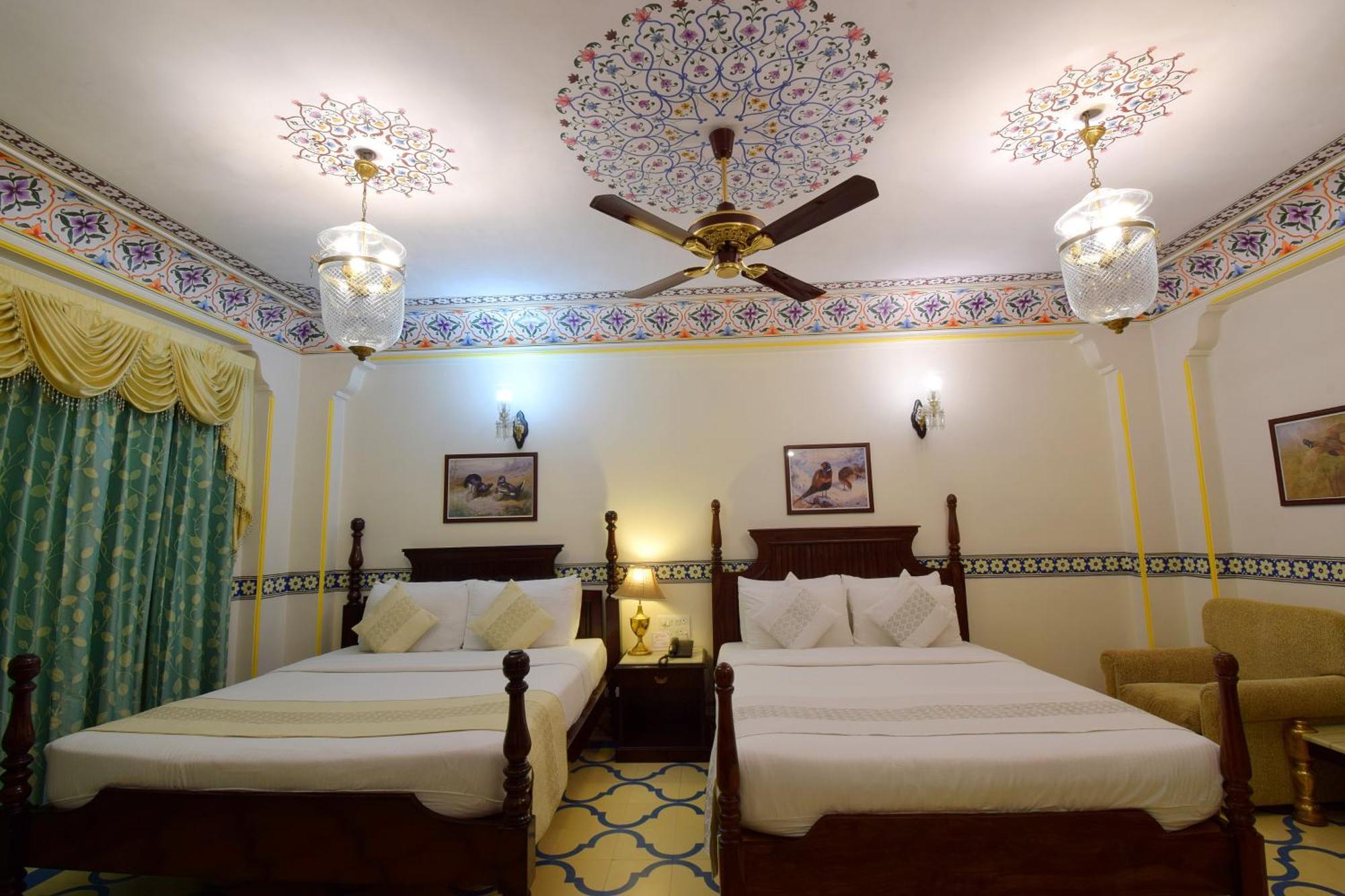 Royal Deluxe Family pickup on arrival from train or bus station Enjoy a daily Rajasthani dance & music show from 7–9 PM swimming pool a dedicated travel desk to assist local sightseeing tours intercity travel arrangements & activit