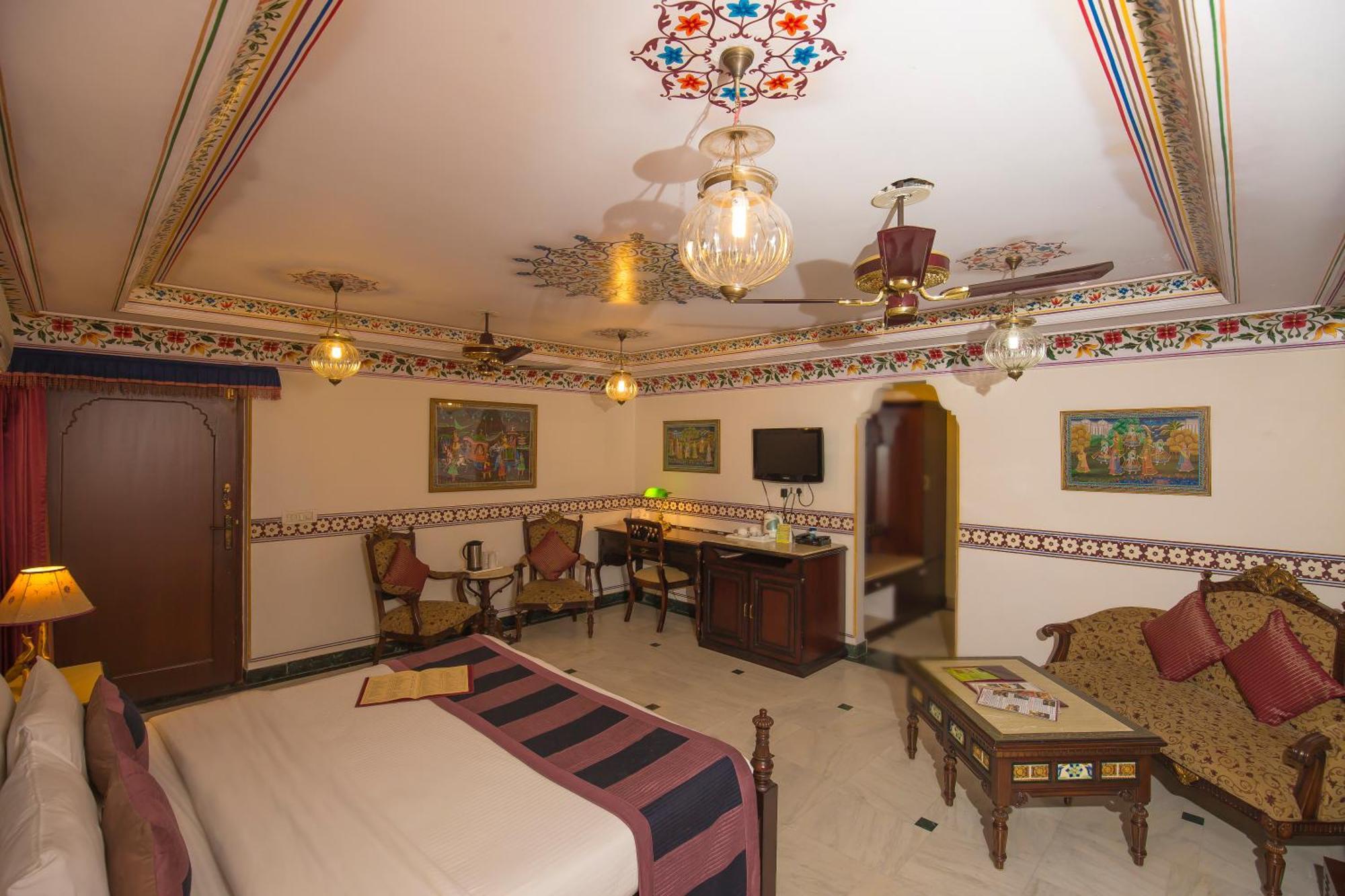 Royal Suite Family pickup on arrival from train or bus station Enjoy a daily Rajasthani dance & music show from 7–9 PM swimming pool a dedicated travel desk to assist local sightseeing tours intercity travel arrangements & activiti