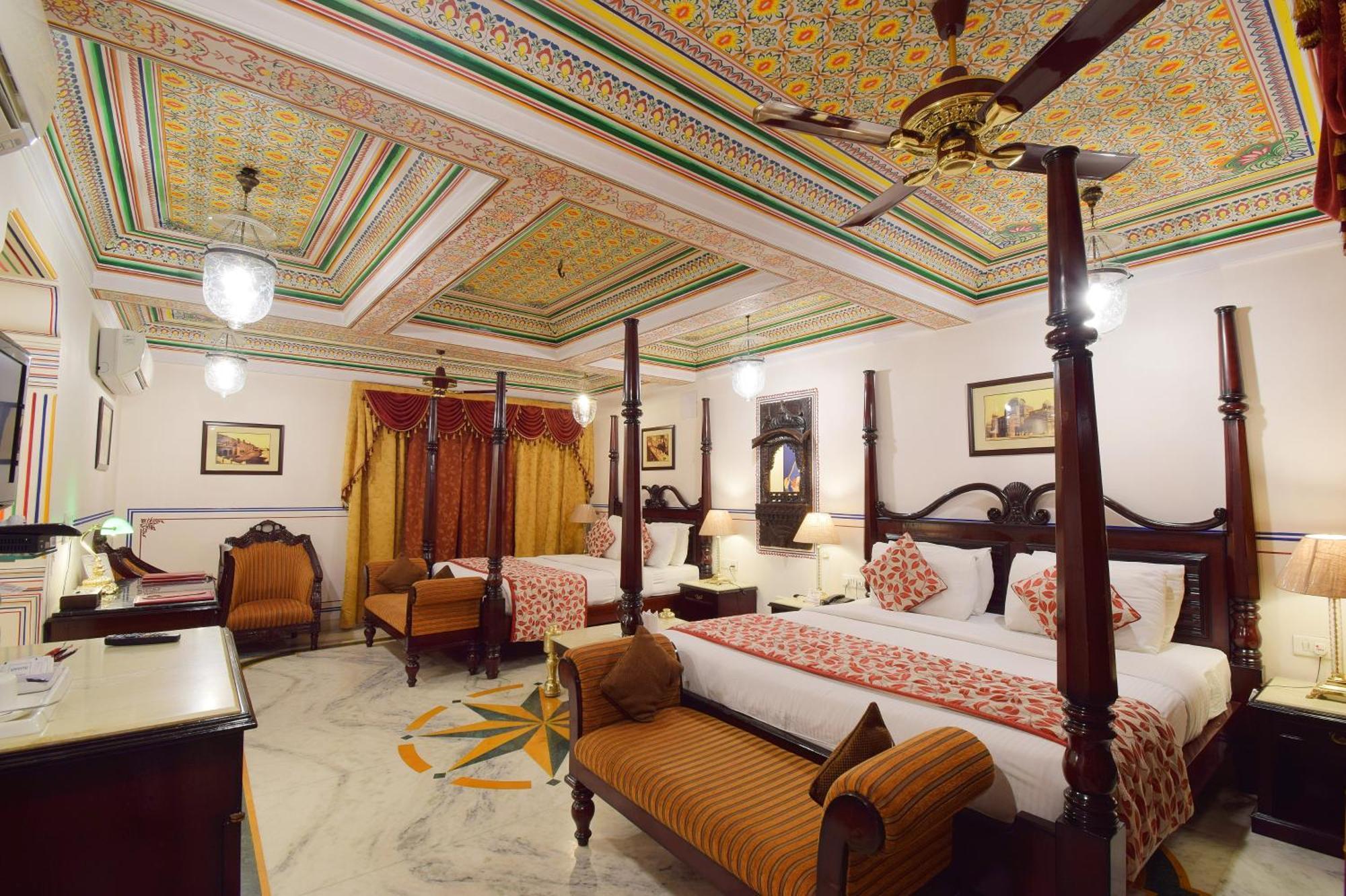 Royal Suite Family pickup on arrival from train or bus station Enjoy a daily Rajasthani dance & music show from 7–9 PM swimming pool a dedicated travel desk to assist local sightseeing tours intercity travel arrangements & activiti