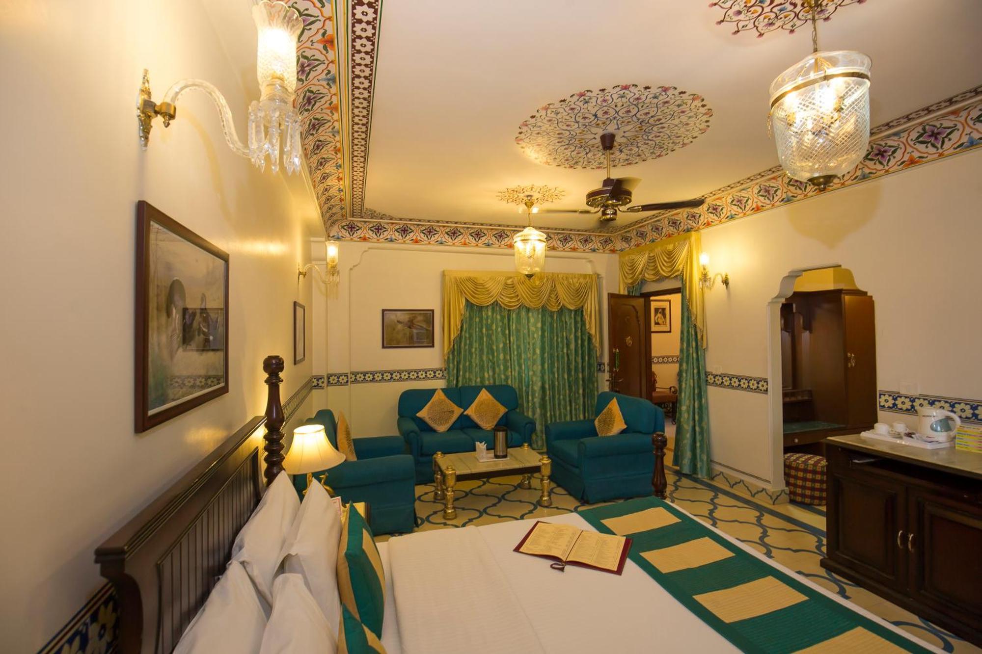 Royal Suite Family pickup on arrival from train or bus station Enjoy a daily Rajasthani dance & music show from 7–9 PM swimming pool a dedicated travel desk to assist local sightseeing tours intercity travel arrangements & activiti