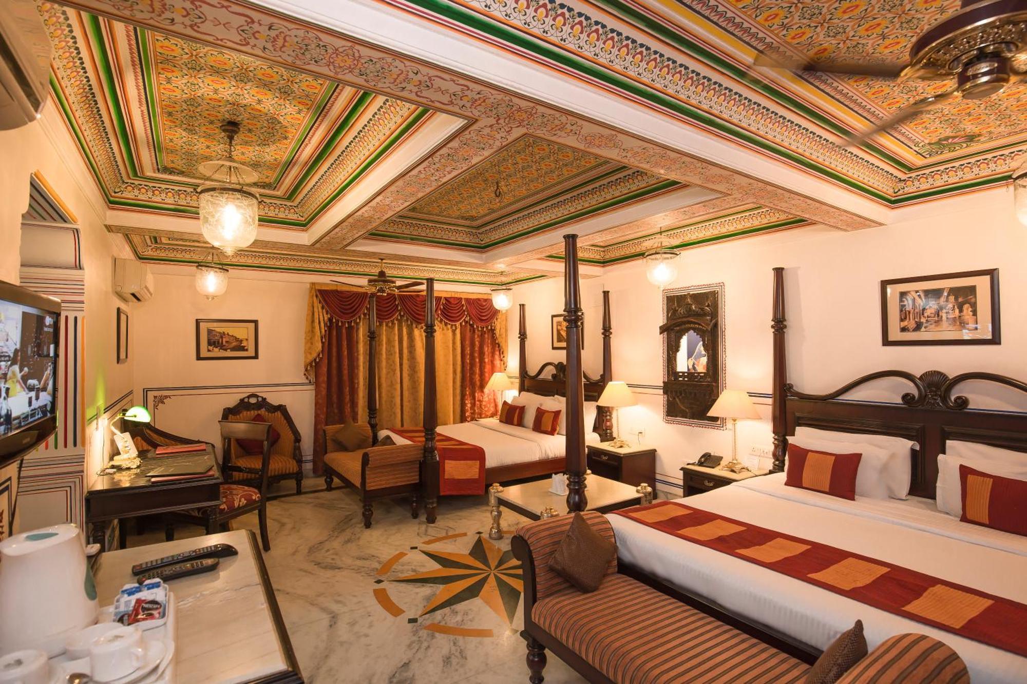Royal Suite Family pickup on arrival from train or bus station Enjoy a daily Rajasthani dance & music show from 7–9 PM swimming pool a dedicated travel desk to assist local sightseeing tours intercity travel arrangements & activiti