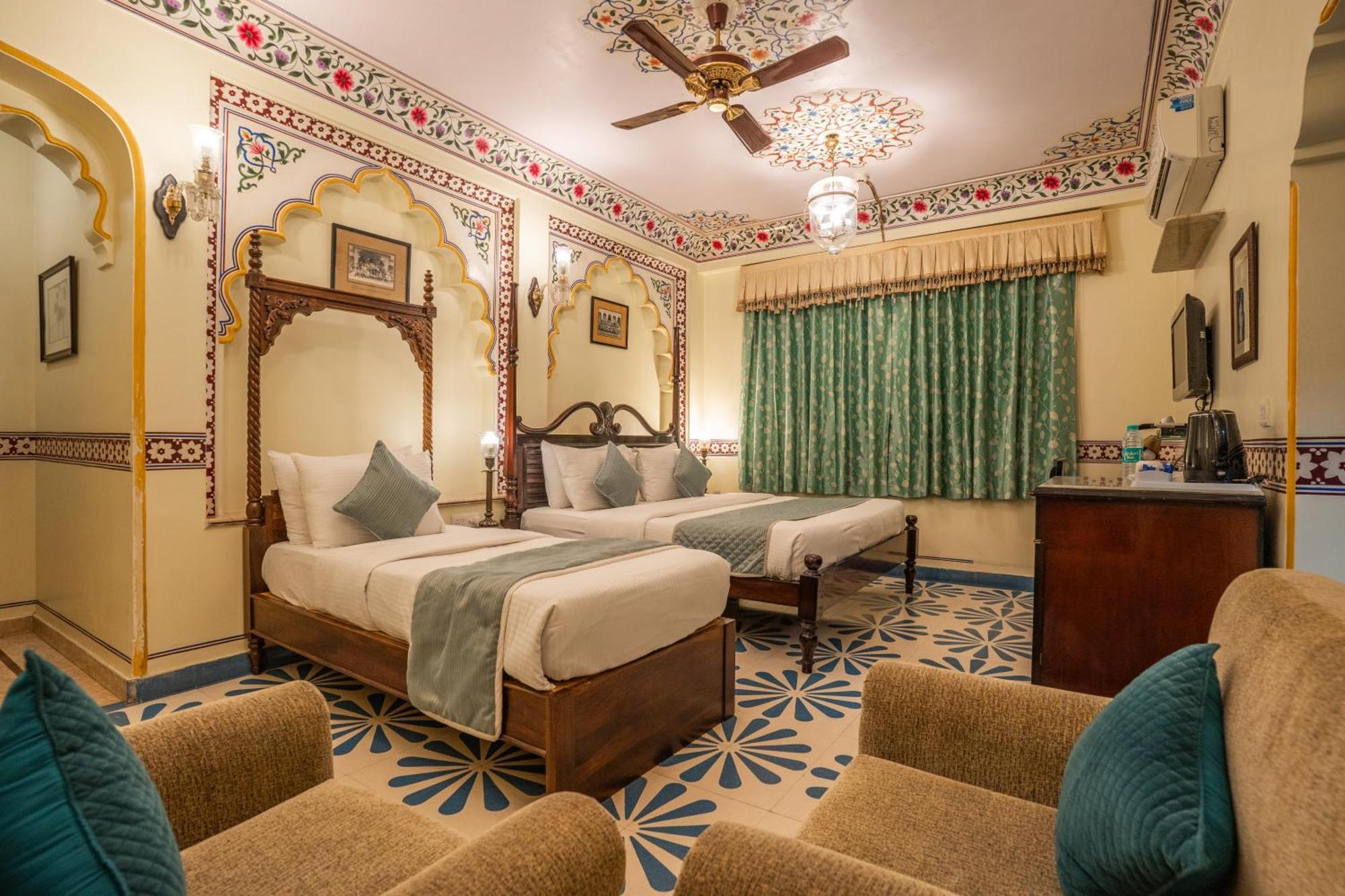 Royal Deluxe Family pickup on arrival from train or bus station Enjoy a daily Rajasthani dance & music show from 7–9 PM swimming pool a dedicated travel desk to assist local sightseeing tours intercity travel arrangements & activit
