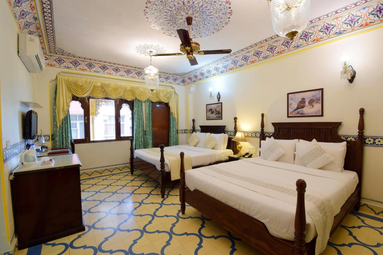 Royal Suite Family pickup on arrival from train or bus station Enjoy a daily Rajasthani dance & music show from 7–9 PM swimming pool a dedicated travel desk to assist local sightseeing tours intercity travel arrangements & activiti